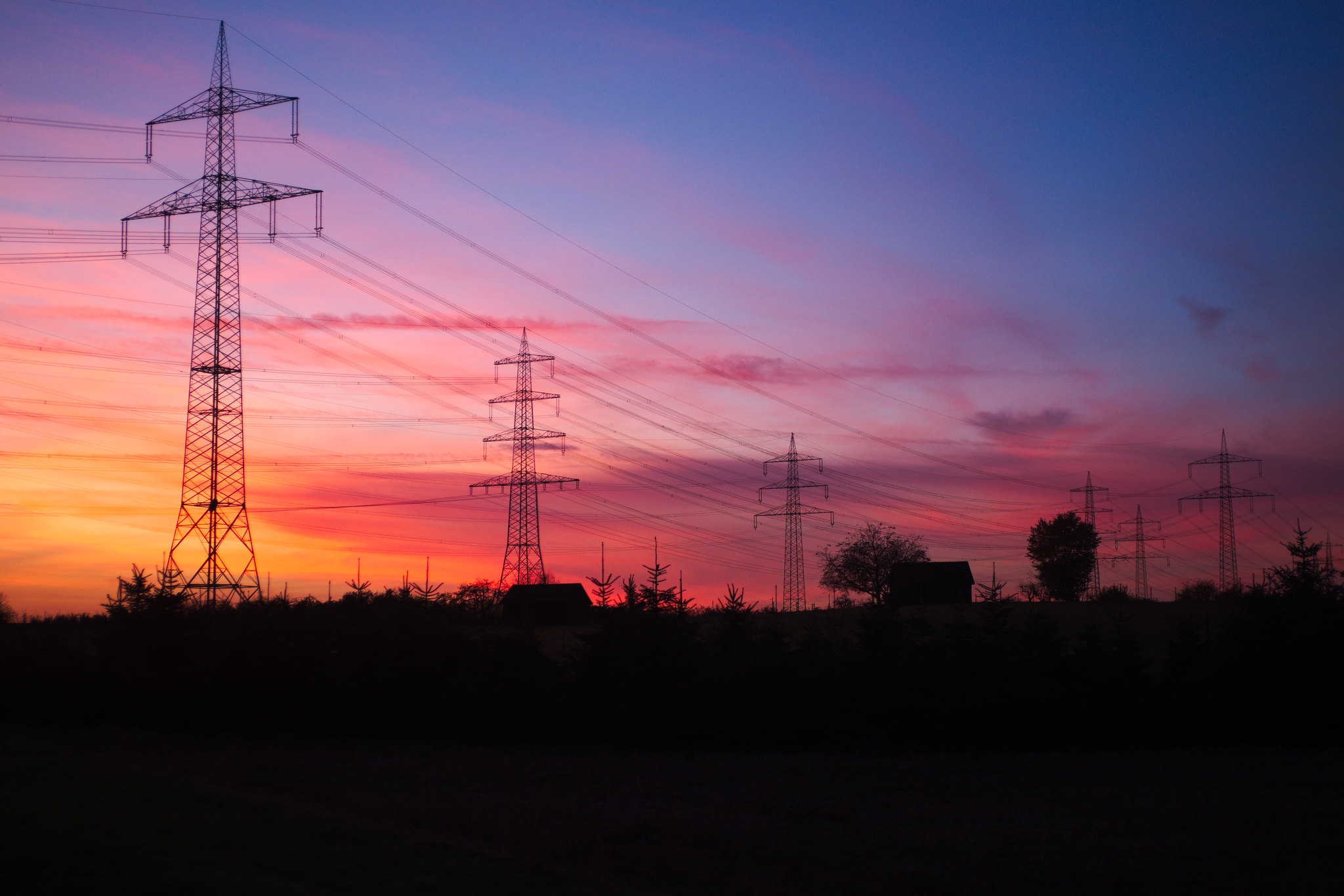 Electricity pylons at sunset